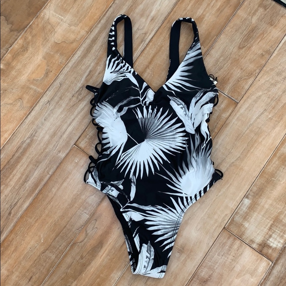 L space one piece , never been worn